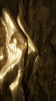 Luxurious gold metallic fabric with flowing waves and rich texture, creating elegant drapes and folds. Perfect for luxury, fashion, and design projects.
