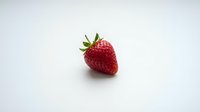 Fresh ripe strawberry with green leaves isolated on white background, suitable for food, nutrition, healthy eating, and culinary projects.