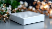 Blank white square podium with dried flowers and bokeh lights, suitable for product display and cosmetic mockups.