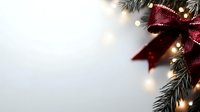 Festive corner border with burgundy glitter bow, pine branches and soft glowing lights against white background, creating elegant holiday atmosphere.