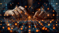 Hands typing on digital interface with glowing orange particles and light effects, perfect for technology, innovation, and digital transformation concepts in business presentations.