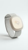 Wearable smartwatch device with light gray fabric band and cream-colored display showing weather icon, isolated on white background for app design, UI mockup, and technology product presentations.