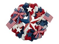 Patriotic wreath with red, white, and blue stars, ribbons, and flags arranged in circular pattern. Isolated on white background, ready for holiday decorating, greeting cards, and design projects.