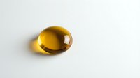 Golden amber oval gemstone with glossy surface isolated on white background for jewelry design and luxury accessories.