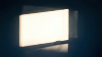 Glowing rectangular light panel or LED screen emitting warm white light against dark background, suitable for technology, modern design, and lighting concepts.