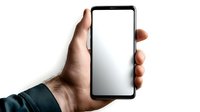 Male hand holding modern black smartphone with blank white screen mockup against white background, isolated device for digital app and mobile interface design.