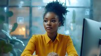 Young African American businesswoman in yellow blouse working at modern office with digital interface elements and icons floating around, technology concept.