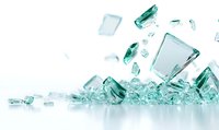 Shattered glass fragments in teal color against white background, creating dynamic composition of sharp shards and reflective surfaces.