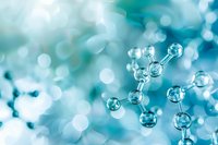 Molecular structure with transparent spheres connected in network pattern against soft blue bokeh background for science and research concepts.