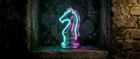 Glowing neon chess knight piece with cyan and magenta lighting effects on wooden surface against textured stone wall background for gaming concepts.