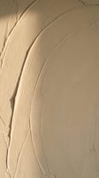 Cream textured paint strokes with dimensional brushwork on neutral background, suitable for abstract art, design backgrounds, and creative projects.