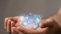 Glowing digital network connections floating above cupped hands with colorful light effects and interconnected nodes for technology concepts.