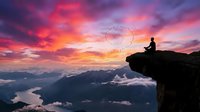 A silhouetted figure sits on a cliff edge overlooking a dramatic mountain landscape at sunset, with vibrant pink and orange clouds, valleys below, and birds flying in formation across the sky.