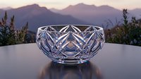 Crystal cut glass bowl with geometric diamond pattern on table against mountain landscape at sunset for elegant dining and home decor.