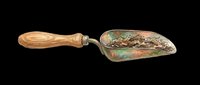 Vintage garden trowel with wooden handle and weathered metal blade isolated on transparent background, ready for design use on t-shirts, clipart, stickers, and print-on-demand products.
