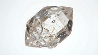 Large rough uncut diamond crystal with natural facets and inclusions on white background isolated for jewelry design and gemstone collection.