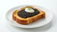 Toasted bread slice topped with caviar and sour cream dollop, garnished with fresh dill on white plate for gourmet appetizer or luxury food styling.