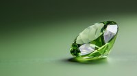 Brilliant peridot gemstone with faceted cut on green background showcasing luxury sparkle and clarity, suitable for jewelry design and precious stone advertising.