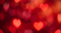 Romantic red heart bokeh lights background for Valentine's Day, love celebrations, wedding invitations, anniversary cards and romantic design projects.