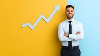Confident Hispanic businessman with crossed arms standing against yellow and blue wall with upward trending arrow, showing growth and success in business.