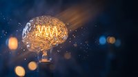 Glowing brain lightbulb with neural networks and electrical circuits symbolizing innovation, creativity, artificial intelligence and bright ideas concept.