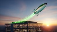 Digital rocket launching from modern office building rooftop with green particle trail against sunset sky for business growth and startup concepts.