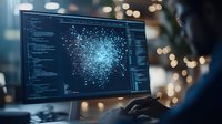 Computer screen displaying network visualization with glowing nodes and connections against dark code background, programmer working late with bokeh lights.
