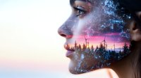 Double exposure portrait combining female profile with sunset forest landscape, mystical fog effect and pink sky creates dreamy nature fusion artwork.