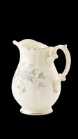 Vintage ceramic pitcher with delicate floral design, cream background with pink and blue flowers, gold trim accents, isolated on transparent background ready for design use, clipart, sublimation, print-on-demand products.