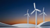 White wind turbines on snowy hills against orange sunset sky showcasing renewable energy and sustainable power generation for environmental projects.