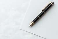 Elegant black and gold fountain pen resting on blank white paper against textured light background, minimalist business composition for writing and correspondence.