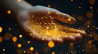 Magical golden glitter sparkles floating above an open palm against dark background, creating mystical atmosphere with glowing bokeh lights and particles.