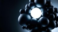 Glowing white sphere surrounded by dark metallic spheres on black background, representing innovation, technology, leadership, and uniqueness in business concepts.