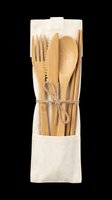 Bamboo cutlery set with fork, knife, spoon and chopsticks in a linen pouch, tied with twine, isolated on transparent background, ready for eco design use.