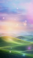 Dreamy rolling hills landscape with soft sunlight and bokeh effects against pastel pink and purple sky, creating magical atmosphere for fairy tale backgrounds.