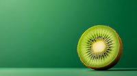 Fresh kiwi fruit slice showing seeds and pulp on green gradient background for healthy eating and nutrition concepts.