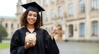 Young African American woman graduate in cap and gown holding piggy bank on university campus, celebrating education investment and financial planning.