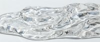 Clear gel or transparent liquid substance with flowing, organic wave patterns and swirls, isolated on white background, suitable for cosmetics, skincare, and product packaging design.