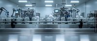 Modern automated pharmaceutical manufacturing facility with robotic assembly line and sterile production equipment in clean room environment.