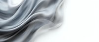 Elegant silver silk fabric with smooth flowing waves and soft folds creating luxurious textile background for fashion and interior design projects.