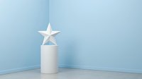 White star decoration sitting atop cylindrical pedestal in minimalist corner setting with soft blue walls, suitable for holiday displays, retail environments, and festive interior design projects.