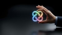 Businessman hand holding glowing neon infinity symbol against dark background, representing endless possibilities, growth, and continuous improvement for business concepts.