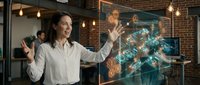 Professional businesswoman interacting with futuristic holographic interface displaying digital network connections in modern office environment.
