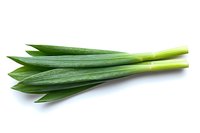 Fresh green pandan leaves isolated on white background, aromatic cooking ingredient used in Asian cuisine and natural food coloring.
