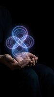 Hands holding glowing infinity symbol with neon light effects on dark background representing endless possibilities and futuristic technology concepts.