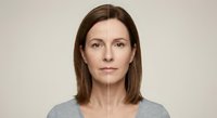 Young woman face showing aging process with half wrinkled skin and half smooth skin on neutral background for skincare and beauty treatment concepts.