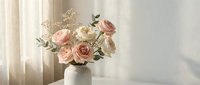 Elegant bouquet of pink and white roses with delicate baby's breath in ceramic vase on sunlit table with soft natural lighting for home decor and floral arrangements.