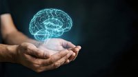 Digital brain hologram floating above cupped hands representing artificial intelligence, neuroscience, and mental health concepts for technology presentations.