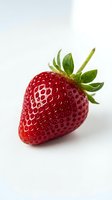 Fresh ripe strawberry with green leafy crown isolated on white background. Use for food, nutrition, healthy eating, organic produce, and culinary projects.