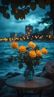 Yellow roses in glass vase on wooden table against dramatic cityscape background with teal water and golden bokeh lights creating moody evening atmosphere.